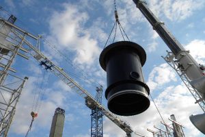 Crane carrying part of a pump