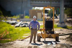 MWI worker posing with Primerite pump
